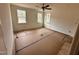 Spacious bedroom with hardwood floors and large windows at 718 Coley Farm Rd, Fuquay Varina, NC 27526