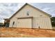 Side view of new construction home with beige siding at 718 Coley Farm Rd, Fuquay Varina, NC 27526