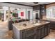 Open kitchen with island, custom cabinetry and views into adjacent living area at 32529 Archdale, Chapel Hill, NC 27517