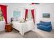 Bright bedroom with red curtains, large bed, and beanbag chair at 32529 Archdale, Chapel Hill, NC 27517