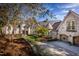 Luxury stone home with circular driveway and manicured lawn at 32529 Archdale, Chapel Hill, NC 27517