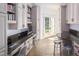Home office with built-in cabinetry, granite counters, and backyard access at 32529 Archdale, Chapel Hill, NC 27517