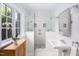 Elegant bathroom with double shower heads, white tile, and a pedestal sink at 32529 Archdale, Chapel Hill, NC 27517