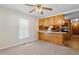 Simple kitchen with light wood cabinets and a breakfast bar at 317 Quintas Ave, Burlington, NC 27215