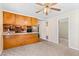 Simple kitchen with light wood cabinets and a breakfast bar at 317 Quintas Ave, Burlington, NC 27215