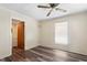 Spacious bedroom with window, ceiling fan, and door to bathroom at 317 Quintas Ave, Burlington, NC 27215