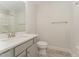 Clean bathroom with gray vanity, white toilet, and shower at 1121 Talisker Way, Burlington, NC 27215