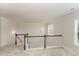 Bright landing with hardwood floors and a chandelier at 1121 Talisker Way, Burlington, NC 27215