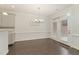 Bright dining area with hardwood floors and French doors to the outdoors at 1121 Talisker Way, Burlington, NC 27215