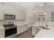 Eat-in kitchen with stainless steel appliances and white cabinets at 1121 Talisker Way, Burlington, NC 27215