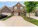 Two-story brick home with double garage and landscaped yard at 1121 Talisker Way, Burlington, NC 27215