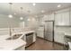Modern kitchen with gray cabinets, stainless steel appliances, and a corner sink at 1121 Talisker Way, Burlington, NC 27215