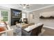 Cozy living room with fireplace, hardwood floors, and comfy seating at 3455 Piedmont Dr, Raleigh, NC 27604