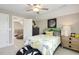Bright bedroom with a ceiling fan, carpet, and plenty of closet space at 3455 Piedmont Dr, Raleigh, NC 27604