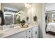 Double vanity bathroom with granite countertop, large mirror, and separate shower at 3455 Piedmont Dr, Raleigh, NC 27604