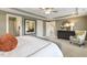 Main bedroom with ceiling fan and large windows at 3455 Piedmont Dr, Raleigh, NC 27604