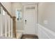 Inviting entryway with staircase, wood flooring, and a coat closet at 3455 Piedmont Dr, Raleigh, NC 27604