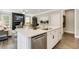 Open kitchen with large island and stainless steel appliances at 3455 Piedmont Dr, Raleigh, NC 27604