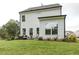 Two-story house with a backyard patio and landscaping at 3455 Piedmont Dr, Raleigh, NC 27604