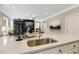 Modern kitchen island with stainless steel sink and granite countertops at 3455 Piedmont Dr, Raleigh, NC 27604