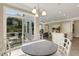 Breakfast nook with view of kitchen and backyard at 3455 Piedmont Dr, Raleigh, NC 27604