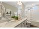 Double vanity bathroom with shower/tub combo and window at 3455 Piedmont Dr, Raleigh, NC 27604