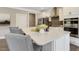 Modern kitchen island with white cabinets and a granite countertop at 3455 Piedmont Dr, Raleigh, NC 27604