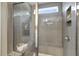 Large walk-in shower with gray tile and built-in seat at 3455 Piedmont Dr, Raleigh, NC 27604