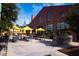 Outdoor patio area with yellow umbrellas and seating at 618 Velma Hopkins Ln, Raleigh, NC 27603