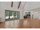 Bright living room with hardwood floors, vaulted ceiling, and sliding glass doors leading to backyard at 3691 Graham Sherron Rd, Wake Forest, NC 27587