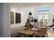 Casual dining area with a wooden table and access to a private patio at 106 Broadway St # 101, Durham, NC 27701