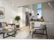 Open floor plan living room with kitchen access and neutral colors at 106 Broadway St # 101, Durham, NC 27701