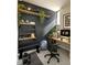 Home office or gym with a desk, exercise equipment, and plants at 106 Broadway St # 207, Durham, NC 27701