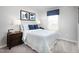 Cozy bedroom with blue and white bedding and window at 6698 Gibraltar Rock Dr, Raleigh, NC 27610