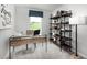Bright home office features built-in shelving and a large window at 6698 Gibraltar Rock Dr, Raleigh, NC 27610
