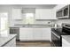Modern kitchen with stainless steel appliances and granite counters at 6698 Gibraltar Rock Dr, Raleigh, NC 27610