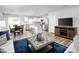Open living room showcasing kitchen, island, and dining area at 6698 Gibraltar Rock Dr, Raleigh, NC 27610