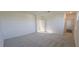 Bright bedroom with carpeted floor and access to other rooms at 191 Robert Howe Dr, Fuquay Varina, NC 27526