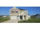 Two-story house, green and beige exterior, two-car garage at 191 Robert Howe Dr, Fuquay Varina, NC 27526