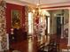 Elegant dining room with a large table and red walls at 236 Olde Ferry Ln, Dunn, NC 28334