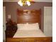 Bedroom with antique wooden bed and soft lighting at 236 Olde Ferry Ln, Dunn, NC 28334