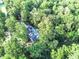 Home surrounded by trees, aerial view at 236 Olde Ferry Ln, Dunn, NC 28334