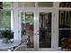 Sunroom with glass doors leading to outdoor patio at 236 Olde Ferry Ln, Dunn, NC 28334