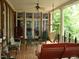 Spacious back porch with a hammock and seating area at 236 Olde Ferry Ln, Dunn, NC 28334