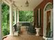 Brick porch with rocking chairs and swing at 236 Olde Ferry Ln, Dunn, NC 28334