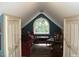 Upstairs sitting area with arched window and comfortable seating at 236 Olde Ferry Ln, Dunn, NC 28334
