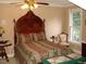 Bedroom with a large antique bed and window at 236 Olde Ferry Ln, Dunn, NC 28334