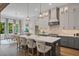 Spacious kitchen with island, stainless steel appliances, and white shaker cabinets at 62 Teal Trace Ct, Pittsboro, NC 27312