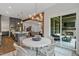 Bright dining area with a round table and access to the backyard patio at 62 Teal Trace Ct, Pittsboro, NC 27312