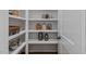 Well-organized pantry with ample shelving for storage at 62 Teal Trace Ct, Pittsboro, NC 27312